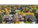 Spacious homes with mature trees, lush lawns, and a playground within the community at 10346 E Crestridge Ln, Englewood, CO 80111