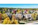Charming neighborhood with colorful fall foliage and mountain views in the distance at 10346 E Crestridge Ln, Englewood, CO 80111
