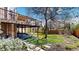 Spacious backyard with a deck and lush green lawn, perfect for outdoor entertaining at 10346 E Crestridge Ln, Englewood, CO 80111