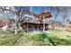Backyard featuring a multi-level deck and patio, perfect for outdoor entertaining at 10346 E Crestridge Ln, Englewood, CO 80111