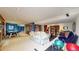 Spacious basement with recreational area, workout space, and comfortable seating at 10346 E Crestridge Ln, Englewood, CO 80111