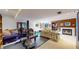 Finished basement space featuring workout equipment and a cozy seating area at 10346 E Crestridge Ln, Englewood, CO 80111