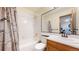 Bright bathroom with tub/shower combination, and a mirrored vanity at 10346 E Crestridge Ln, Englewood, CO 80111