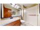 Bathroom features a shower with sliding doors, granite countertop vanity, and a large mirror at 10346 E Crestridge Ln, Englewood, CO 80111