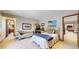 Inviting bedroom with a cozy chaise lounge, soft bedding, and neutral decor, offering a relaxing retreat at 10346 E Crestridge Ln, Englewood, CO 80111
