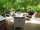 Spacious outdoor deck featuring comfortable seating around a modern fire pit, perfect for relaxation and entertaining at 10346 E Crestridge Ln, Englewood, CO 80111