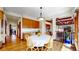 Dining area featuring hardwood floors, wood cabinets and seating for four at 10346 E Crestridge Ln, Englewood, CO 80111