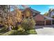 Charming red brick home with well-maintained landscaping and a two-car garage at 10346 E Crestridge Ln, Englewood, CO 80111