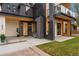 Contemporary home featuring a striking black and white facade, sleek lines, and modern design at 1675 S Steele St, Denver, CO 80210