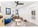 Fun playroom featuring a colorful rug, comfortable seating, and black windows at 1675 S Steele St, Denver, CO 80210