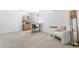 Finished basement with a casual seating area, workstation, and natural light from a small window at 9093 Dudley St, Westminster, CO 80021