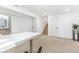 Finished basement with carpet, and an open layout with a work space and bathroom at 9093 Dudley St, Westminster, CO 80021