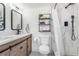 Bathroom features a vanity with double sinks, a shower, and modern fixtures at 9093 Dudley St, Westminster, CO 80021