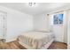 Cozy bedroom with hardwood floors, window and natural light at 9093 Dudley St, Westminster, CO 80021