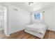 Bright bedroom features hardwood floors, a window and white walls at 9093 Dudley St, Westminster, CO 80021