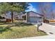 Charming single-Gathering home featuring a well-maintained lawn, two car garage, and cozy curb appeal at 9093 Dudley St, Westminster, CO 80021