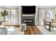 Inviting living room with a cozy electric fireplace, a mounted TV, and great natural light at 9093 Dudley St, Westminster, CO 80021