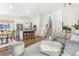 Inviting living area with an open floor plan, hardwood floors, stylish furniture, and a staircase nearby at 9093 Dudley St, Westminster, CO 80021