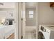 Clean bathroom with a bathtub and a washer and dryer at 1419 Detroit St # 25, Denver, CO 80206