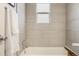 Clean bathroom with bathtub and tile surround at 1419 Detroit St # 25, Denver, CO 80206