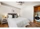 Main bedroom with a queen bed and access to laundry at 1419 Detroit St # 25, Denver, CO 80206