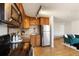 Efficient kitchen features wood cabinets, stainless steel appliances, and granite countertops at 1419 Detroit St # 25, Denver, CO 80206