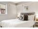 Relaxing main bedroom showcases a plush bed, neutral decor, and a bright window at 1419 Detroit St # 25, Denver, CO 80206