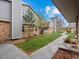 Exterior view of landscaped common area and pathway between the townhomes at 1517 S Owens St # 9, Denver, CO 80232