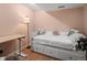 Basement bedroom with a daybed and desk at 1517 S Owens St # 9, Denver, CO 80232
