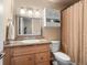 Classic bathroom featuring a vanity with a granite countertop and a shower at 1517 S Owens St # 9, Denver, CO 80232