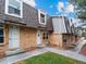 Charming townhome featuring a brick exterior and well-maintained landscaping at 1517 S Owens St # 9, Denver, CO 80232