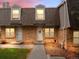 Charming brick townhome with a landscaped yard and inviting entrance at 1517 S Owens St # 9, Denver, CO 80232