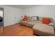 Cozy living room featuring hardwood floors, a large sectional sofa at 1517 S Owens St # 9, Denver, CO 80232