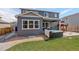 Backyard with a well-manicured lawn, a hot tub and a patio at 6889 E 119Th Ave, Thornton, CO 80233