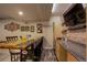 Finished basement bar with unique design, stools, and shelving at 6889 E 119Th Ave, Thornton, CO 80233