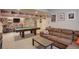 Finished basement with a pool table, entertainment center, and comfortable seating at 6889 E 119Th Ave, Thornton, CO 80233