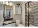 Modern bathroom featuring a walk-in shower, vessel sink, and storage cabinet at 6889 E 119Th Ave, Thornton, CO 80233