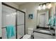 Well-lit bathroom with a framed shower, and stone countertop at 6889 E 119Th Ave, Thornton, CO 80233