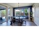 Bright dining area with stylish furniture, sliding glass door, and large windows at 6889 E 119Th Ave, Thornton, CO 80233