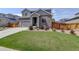 Charming two-story home with a well-maintained lawn and attached two-car garage at 6889 E 119Th Ave, Thornton, CO 80233