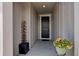 Inviting front porch with decorative water fountain and colorful potted flowers at 6889 E 119Th Ave, Thornton, CO 80233