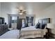 Cozy main bedroom with ceiling fan, lots of natural light, and a wardrobe closet at 6889 E 119Th Ave, Thornton, CO 80233