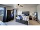Comfortable main bedroom features a ceiling fan, a wardrobe closet, and blue accents at 6889 E 119Th Ave, Thornton, CO 80233