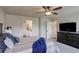 This main bedroom offers a ceiling fan, ensuite bathroom, and a spacious closet at 6889 E 119Th Ave, Thornton, CO 80233
