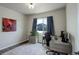 Home office featuring a large window, desk, office chair, and decorative rug at 6889 E 119Th Ave, Thornton, CO 80233