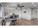 Spacious office with wood-look floors, recessed lighting, custom shelving and an exterior view at 6889 E 119Th Ave, Thornton, CO 80233