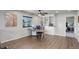 Large office space with wood-look floors, custom built-ins, and an exterior view at 6889 E 119Th Ave, Thornton, CO 80233