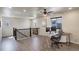 Upper-level office space featuring wood floors, with a ceiling fan and natural light at 6889 E 119Th Ave, Thornton, CO 80233