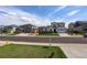 Neighborhood street featuring manicured lawns and sidewalks on a sunny day at 6889 E 119Th Ave, Thornton, CO 80233