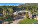 Scenic aerial view of two homes surrounded by lush greenery and mature trees, offering a peaceful and private setting at 93 Greeley Blvd, Palmer Lake, CO 80133